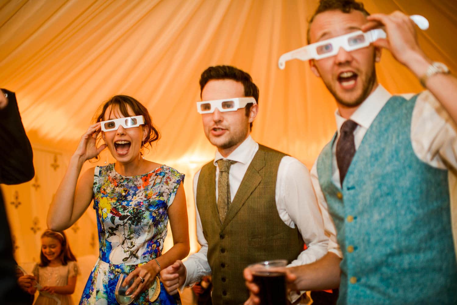 wedding guests wearing 3d glasses
