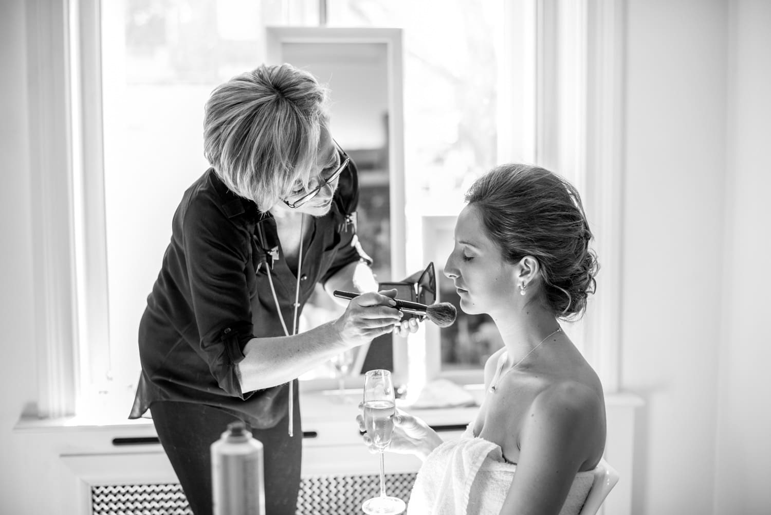 bride having makeup applied