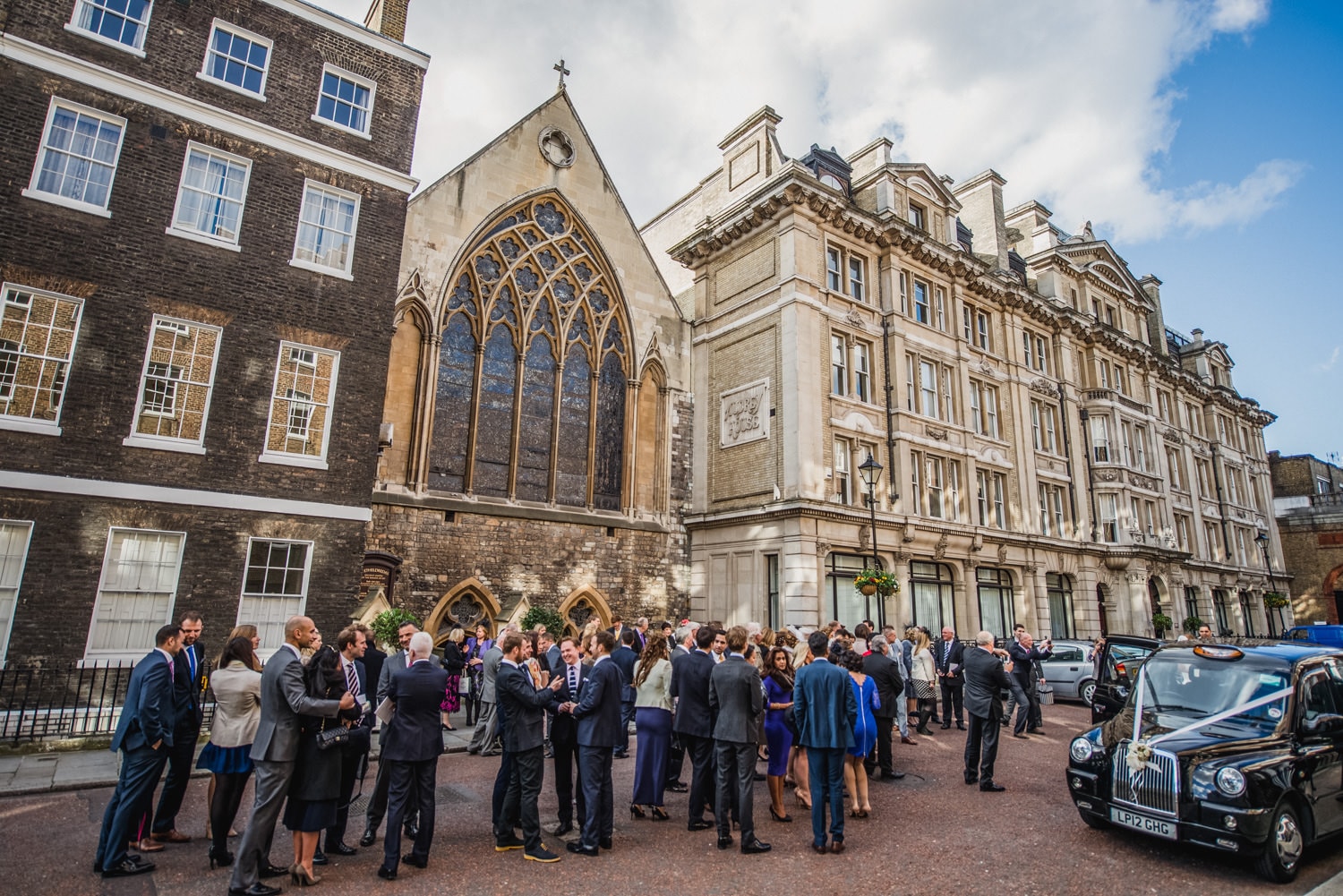 guests outside St Etheldredas church