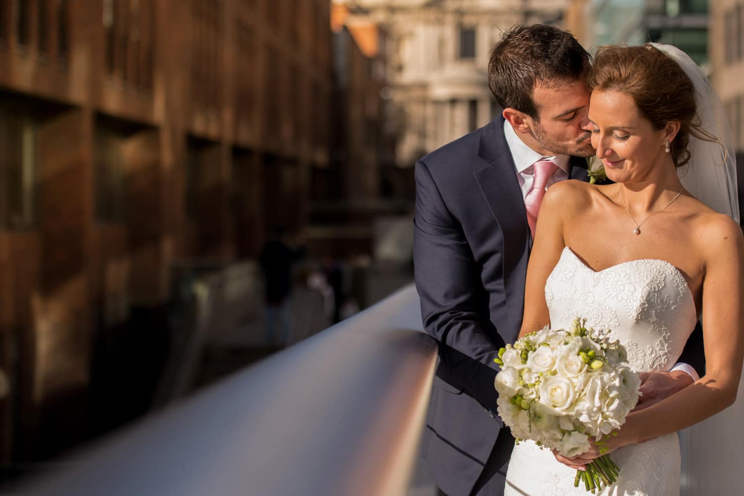 bride and groom portraits in front of St Pauls cathedral