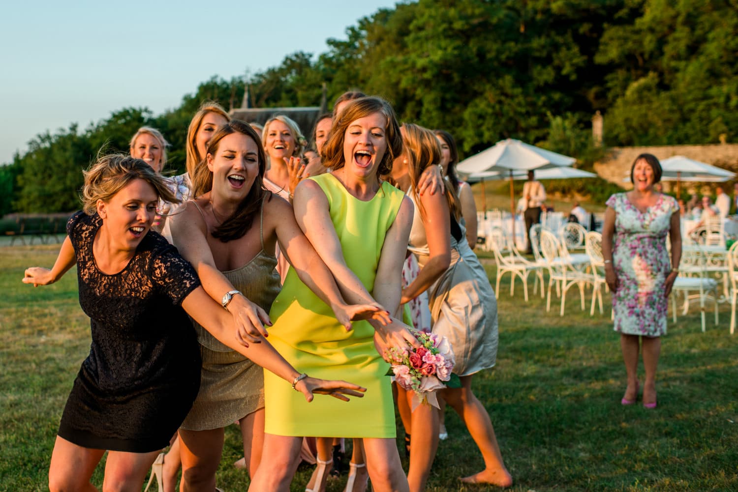 ladies waiting to catch wedding bouquet at Chateau de Lacoste