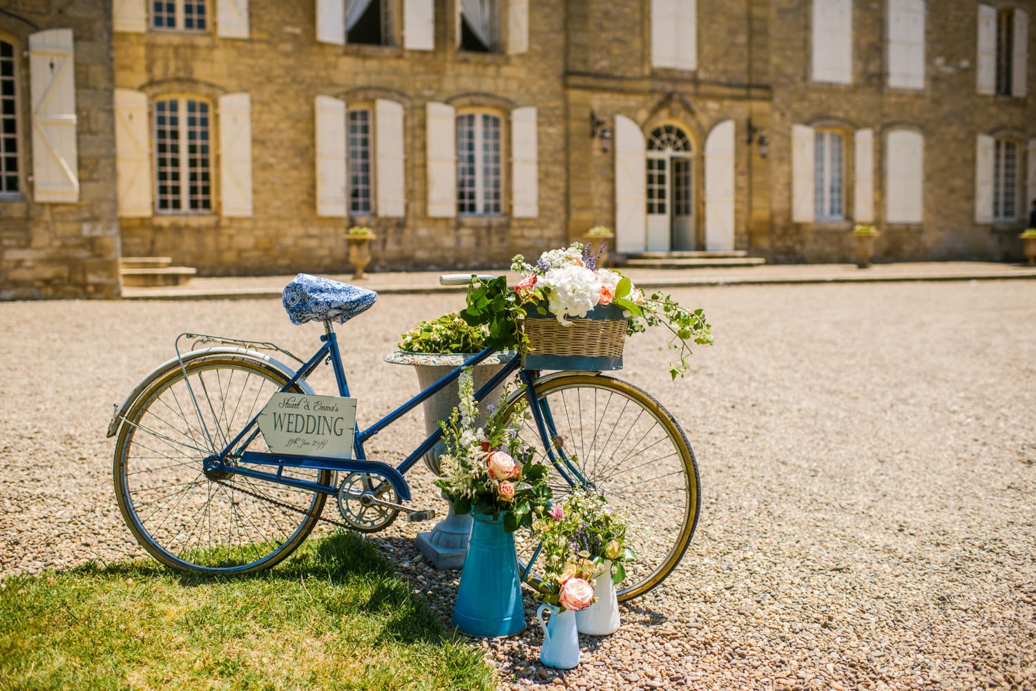 Bike with flowers outside Chateau de Lacoste wedding venue