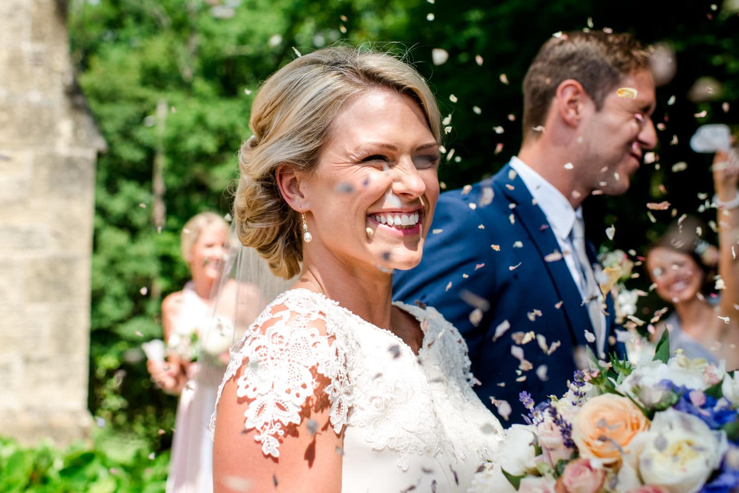 confetti outside chapel of wedding ceremony in the chapel of Chateau de Lacoste wedding venue