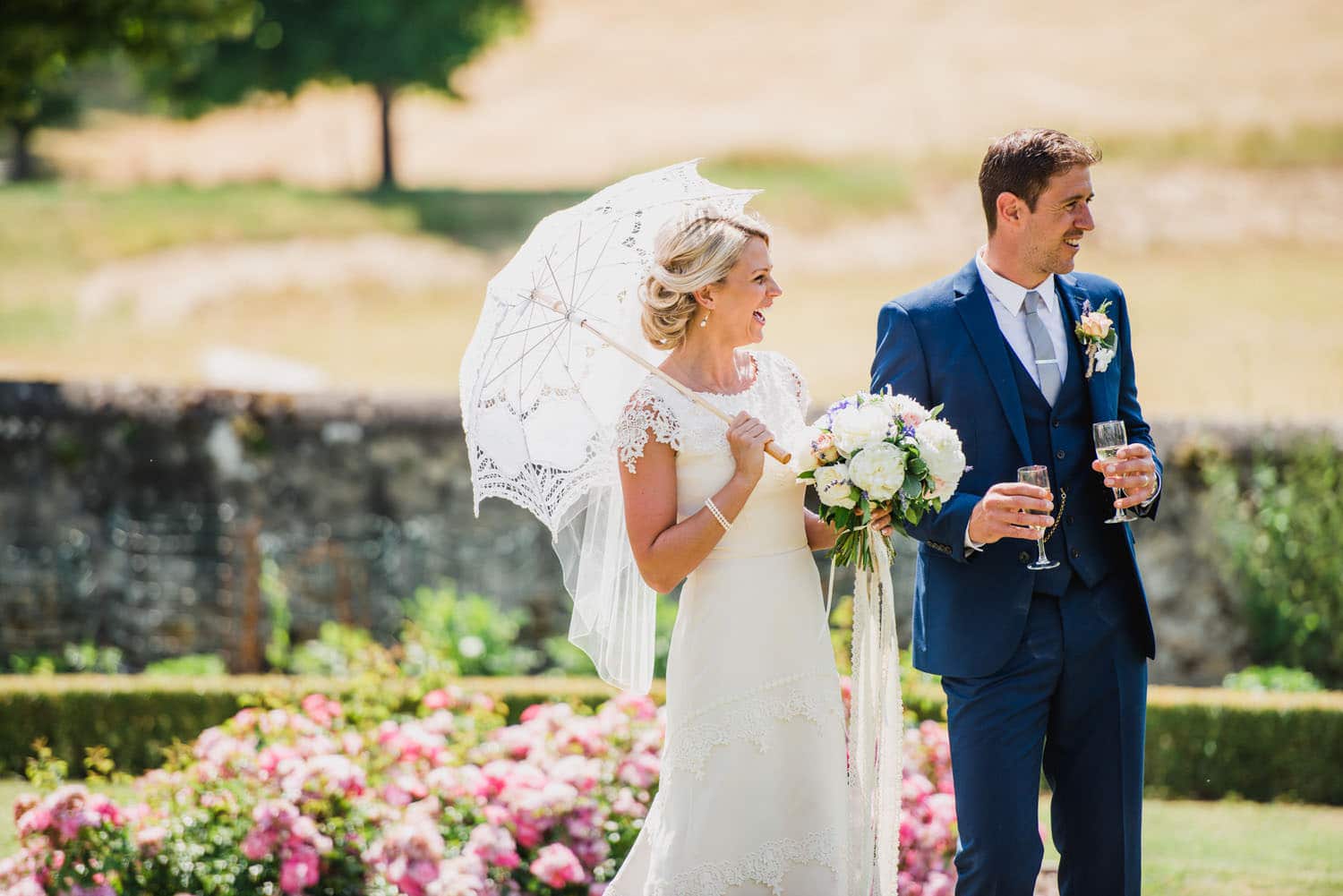 bride with white parasol in France