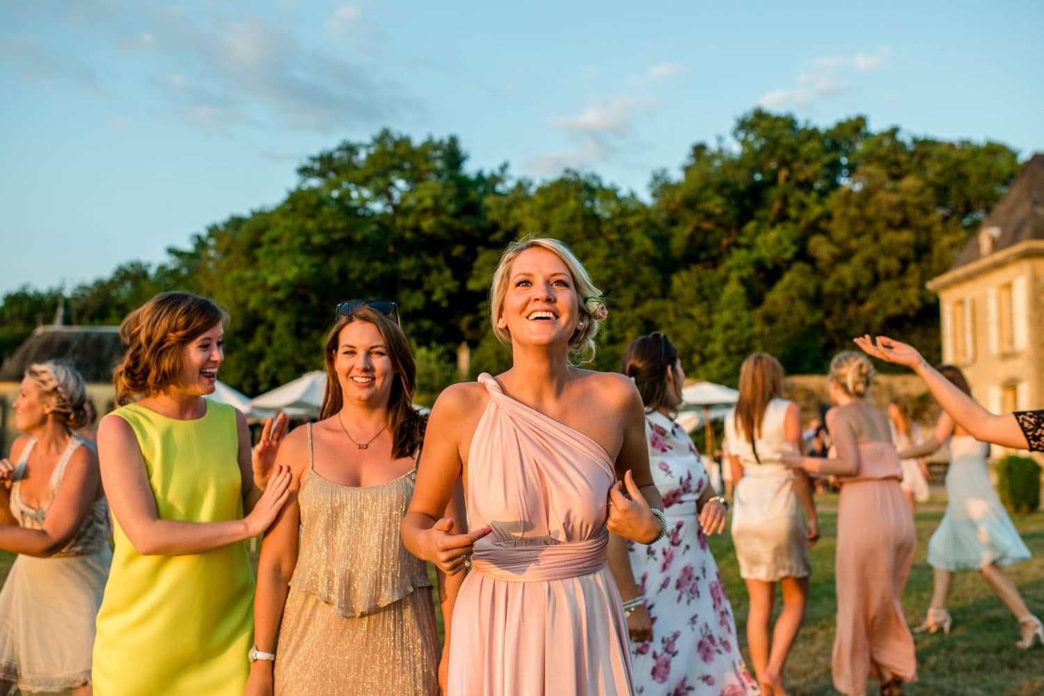 ladies waiting to catch wedding bouquet at Chateau de Lacoste