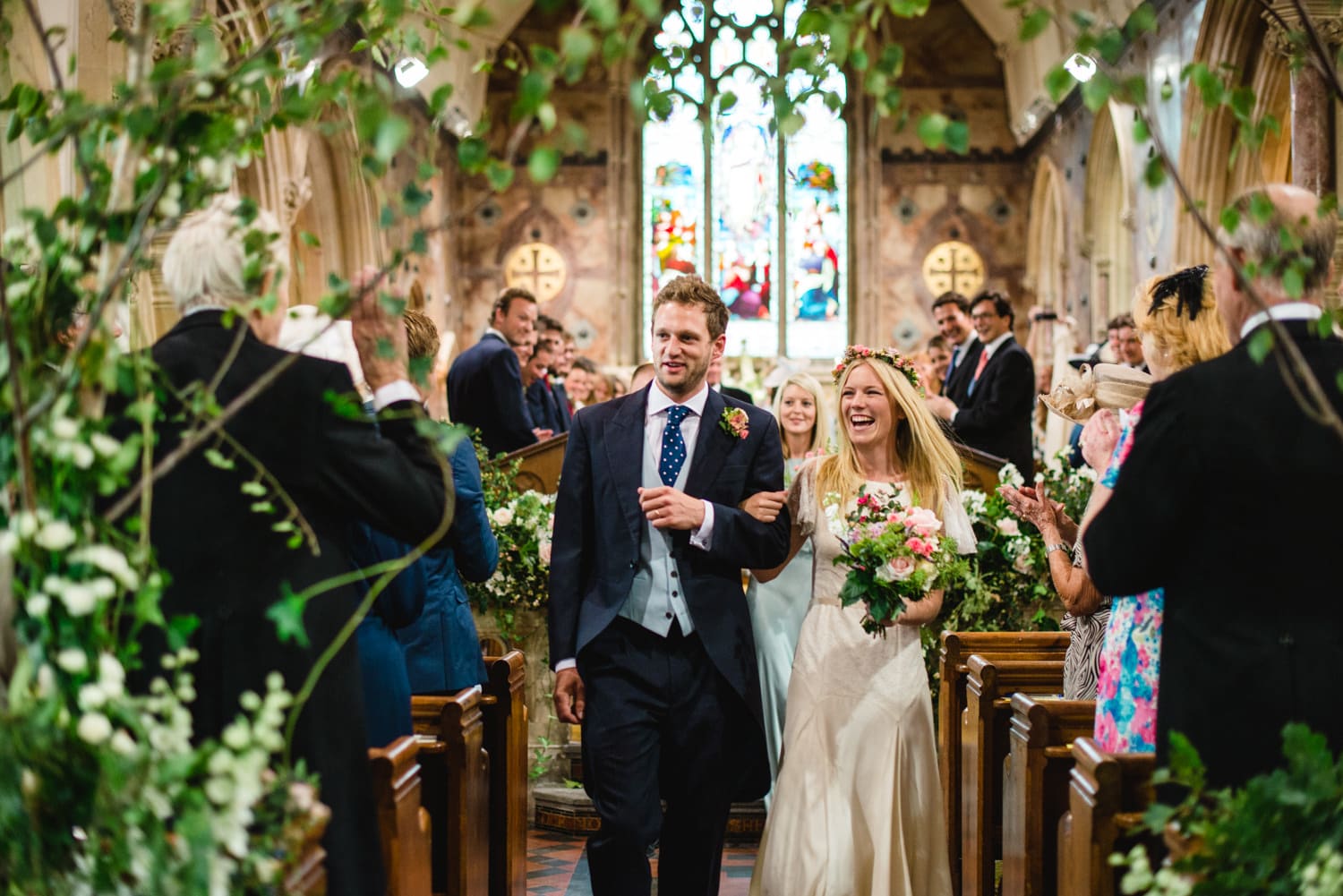 bride and groom walking down the aisle together