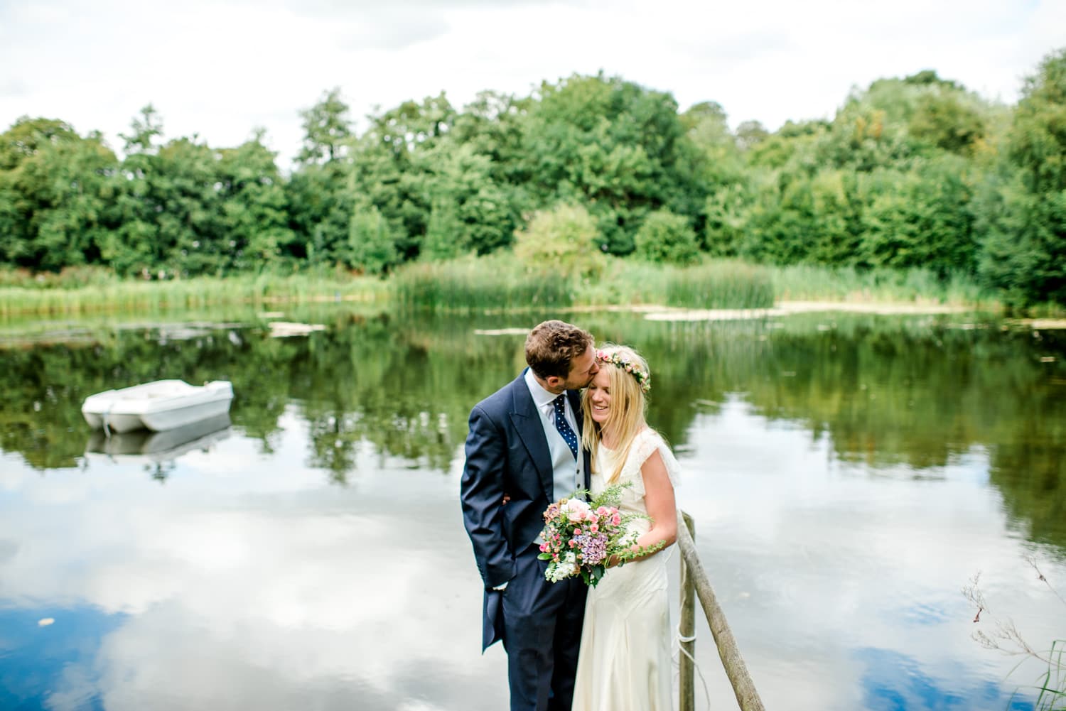 bride and groom portrait by lake