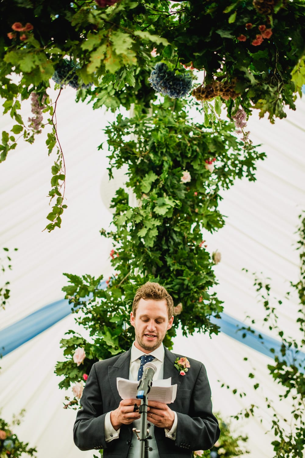 grooms speech in wedding marquee