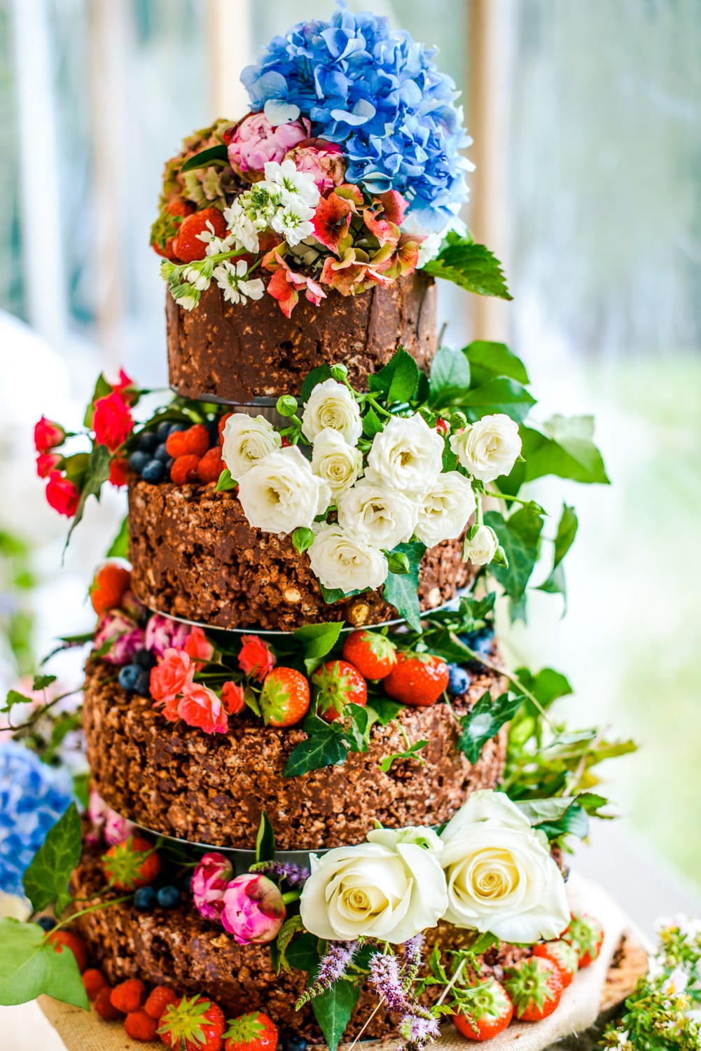 chocolate rice crispy wedding cake with flowers and fruit