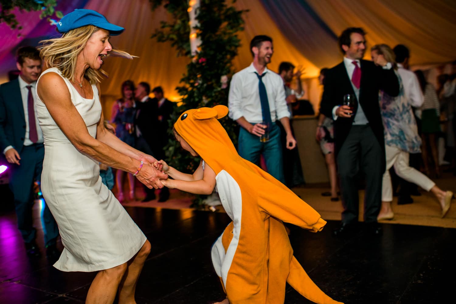 kid in pikachu outfit on dancefloor