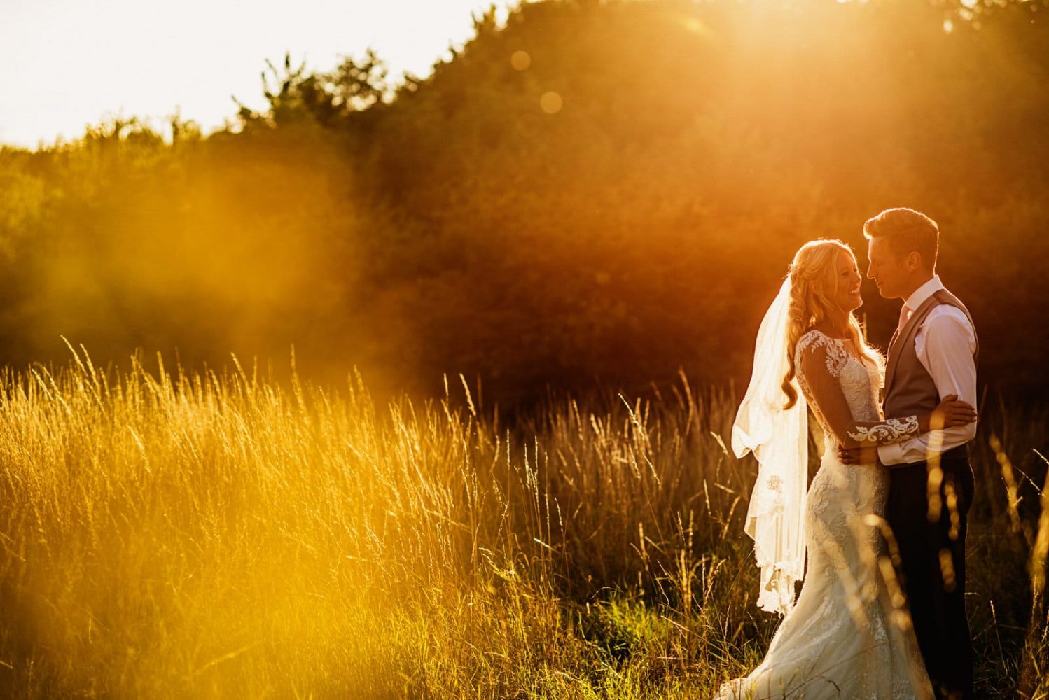 bride and groom during sunset