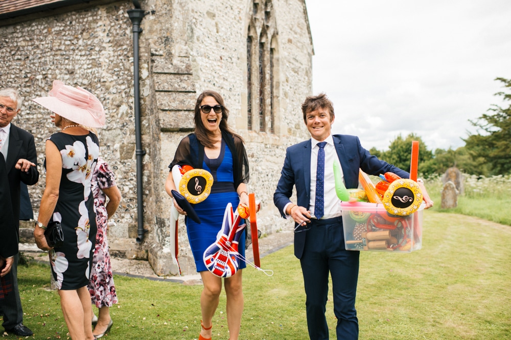 Guests holding inflatable musical instruments