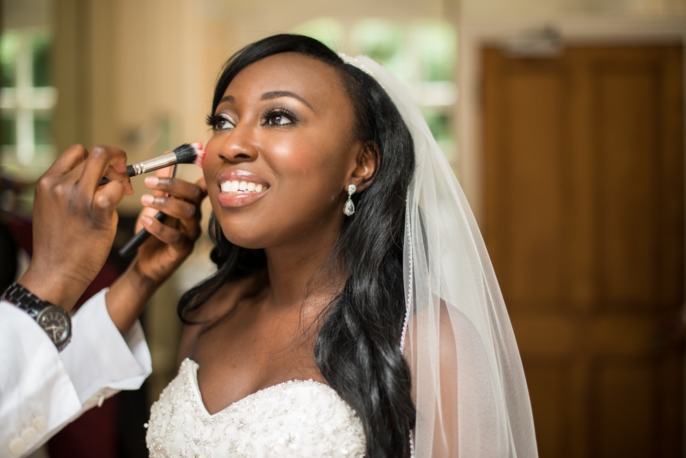 Bride having makeup applied