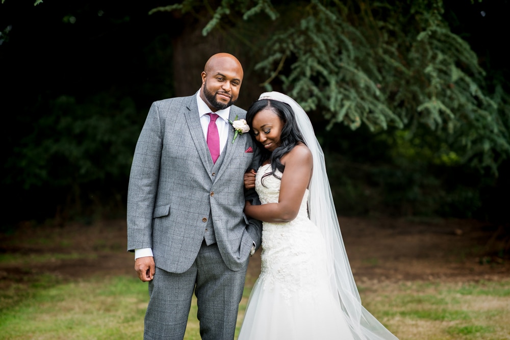 Bride and groom portraits at Father of the bride giving his speech at wedding speeches at High Elms Manor