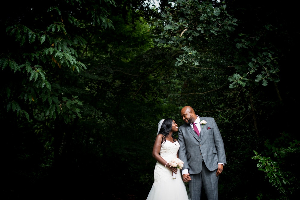 Bride and groom portraits at Father of the bride giving his speech at wedding speeches at High Elms Manor