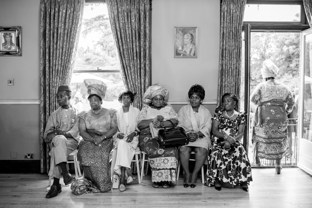 African Caribbean wedding, guests sitting on chairs