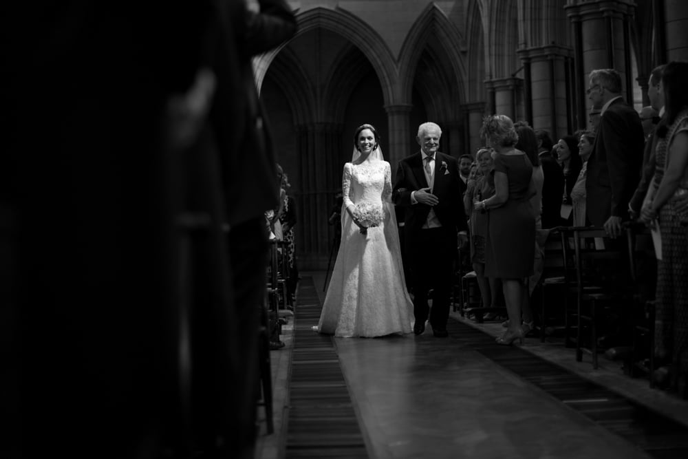 bride walking down the aisle at St james Church London