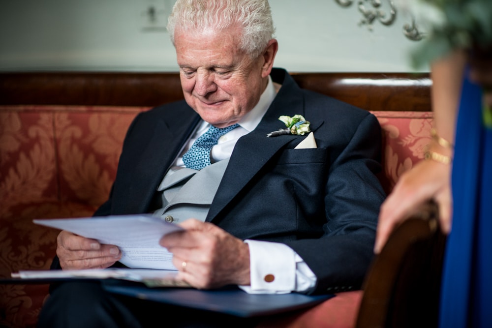 father of the bride checking his speech