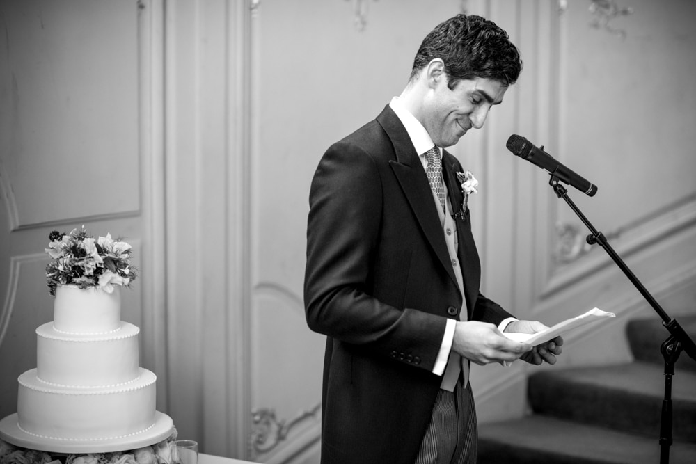 grooms speech on the stairs at the Savile Club London wedding
