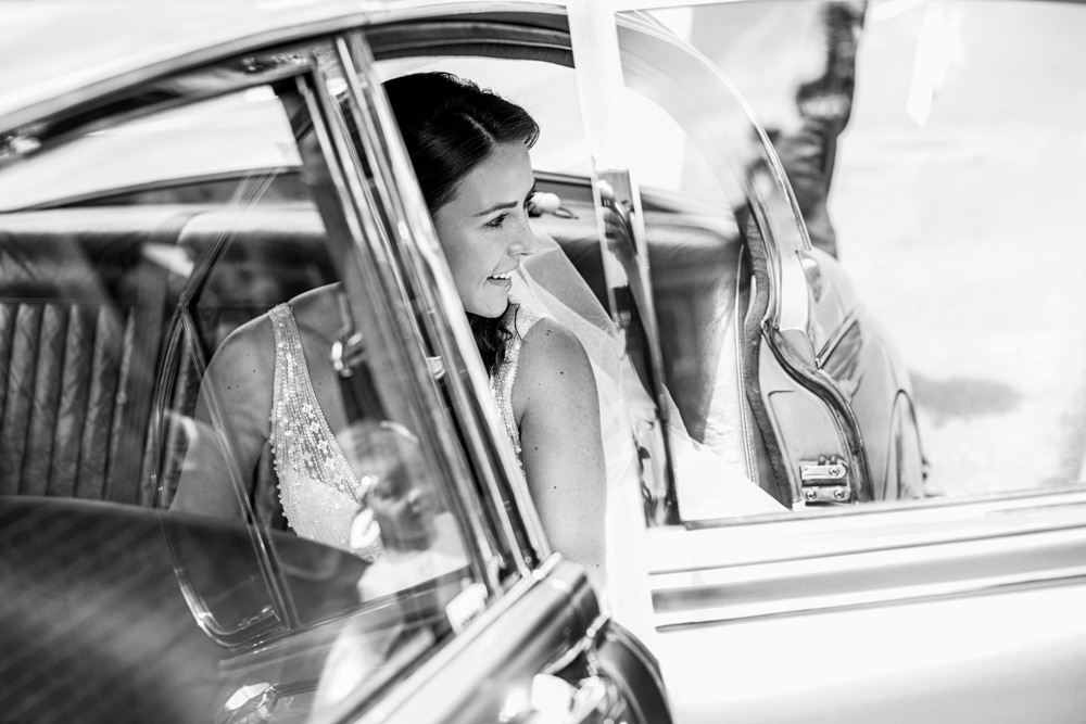 beautiful bride getting out wedding car