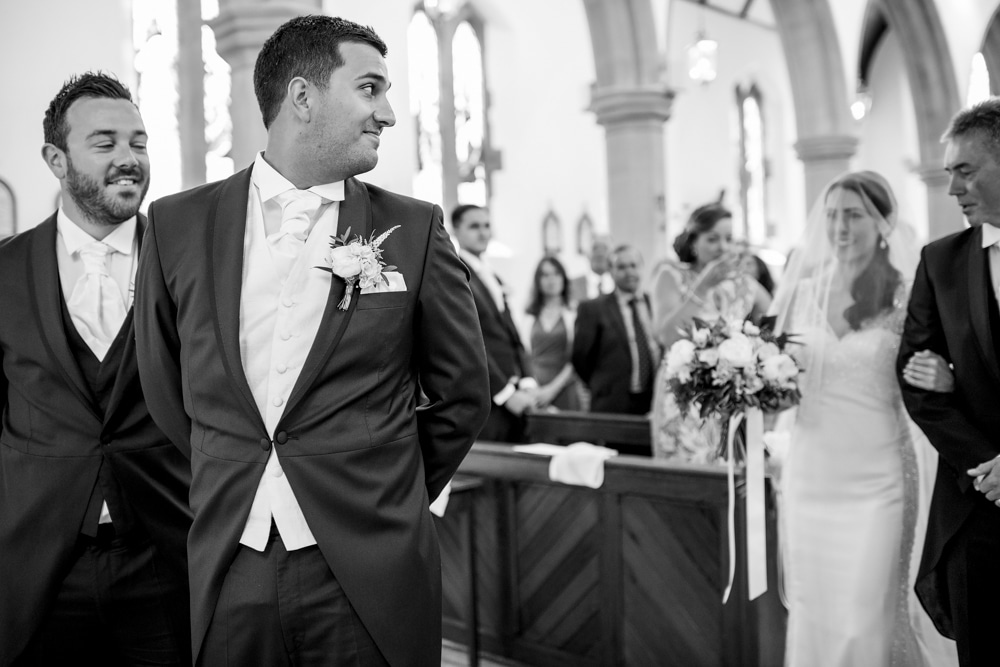 groom waiting at church