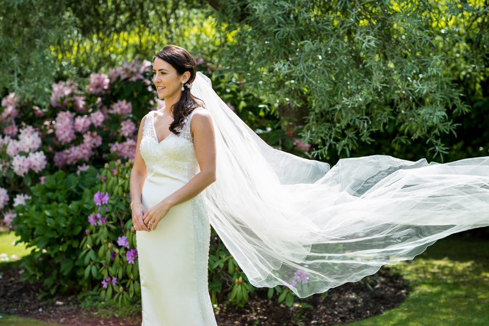 bridal portrait with veil blowing in wind