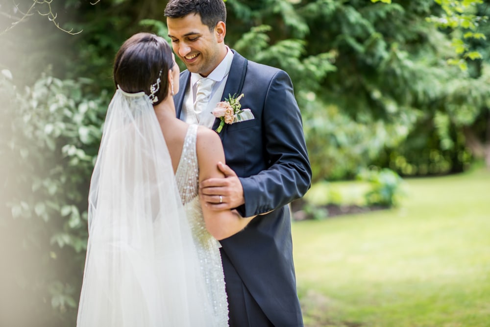 portrait of groom looking at bride