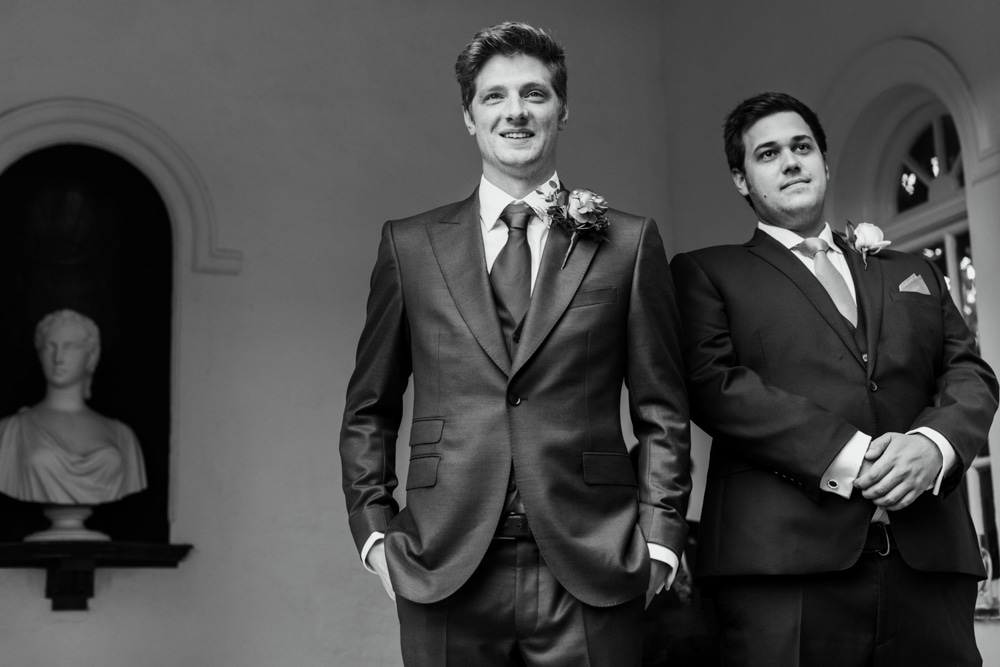 Groom and best man waiting for bride