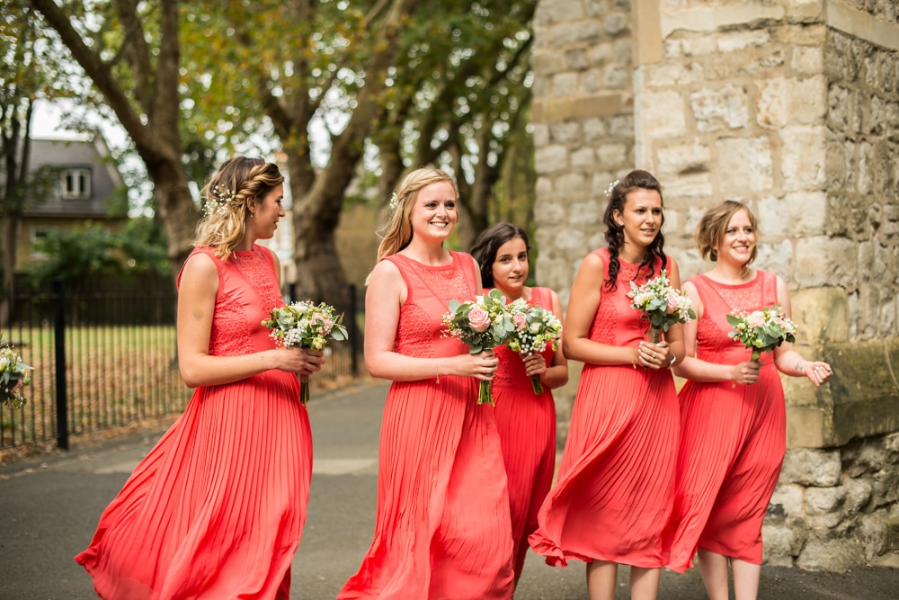 bridesmaids at church in pink dresses
