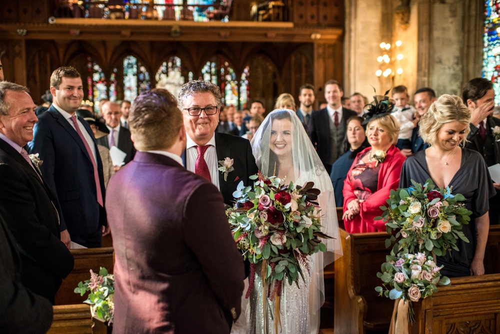 bride walking down the aisle with her father at st etheldreda's church