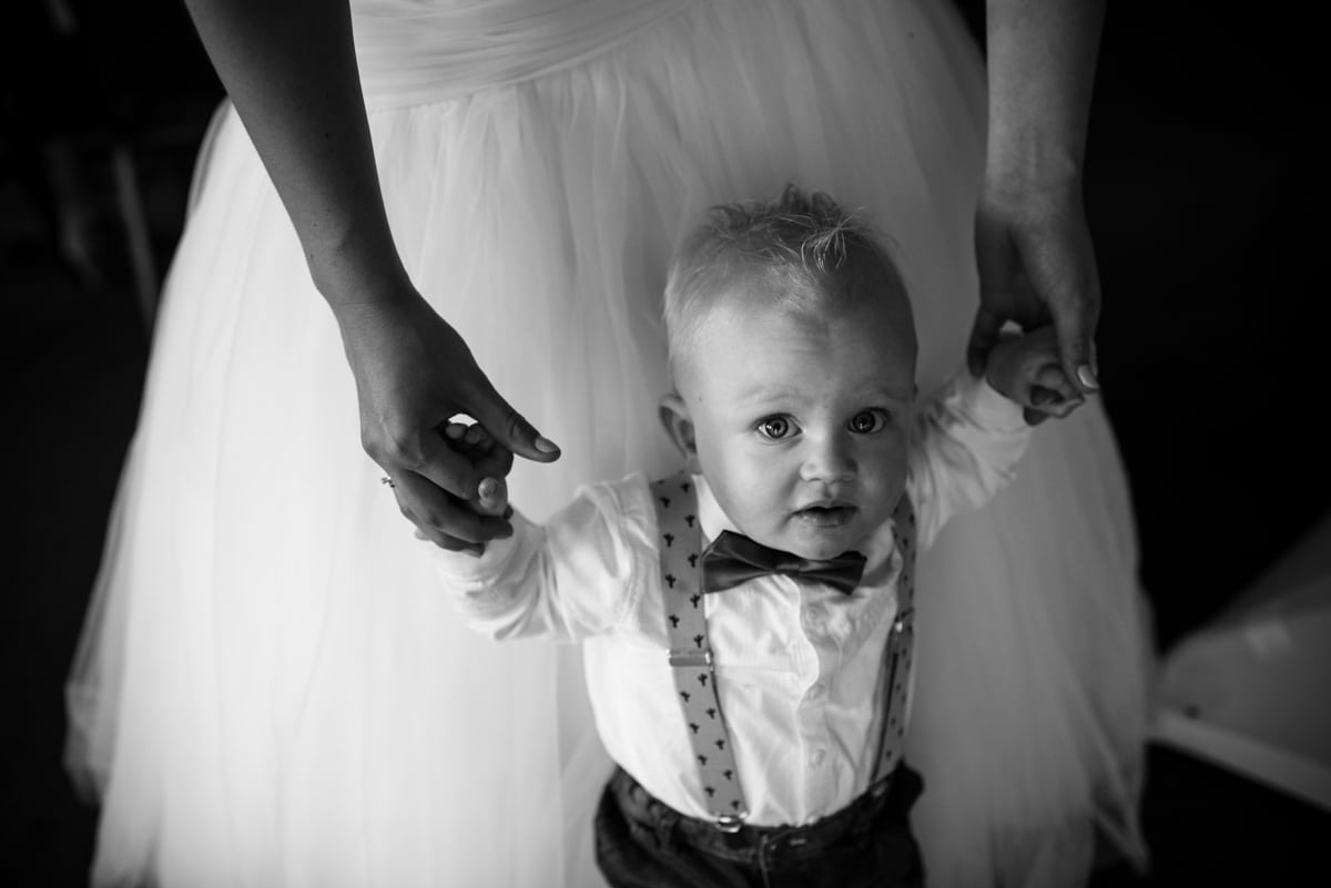 page boy with braces and bow tie