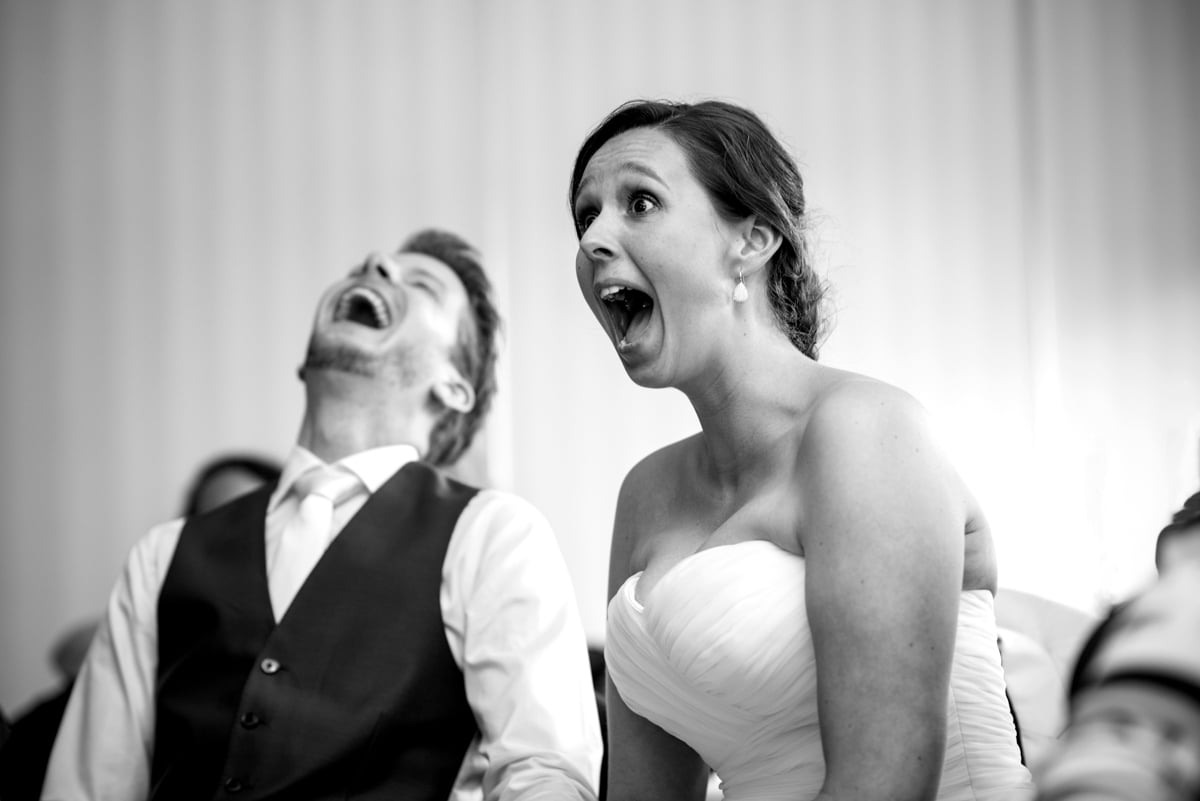 bride and groom laughing