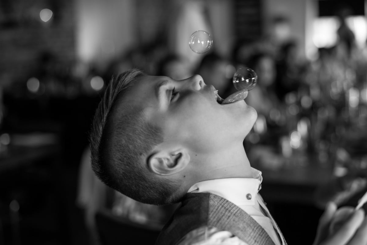 kids at weddings, bubble on boys tongue