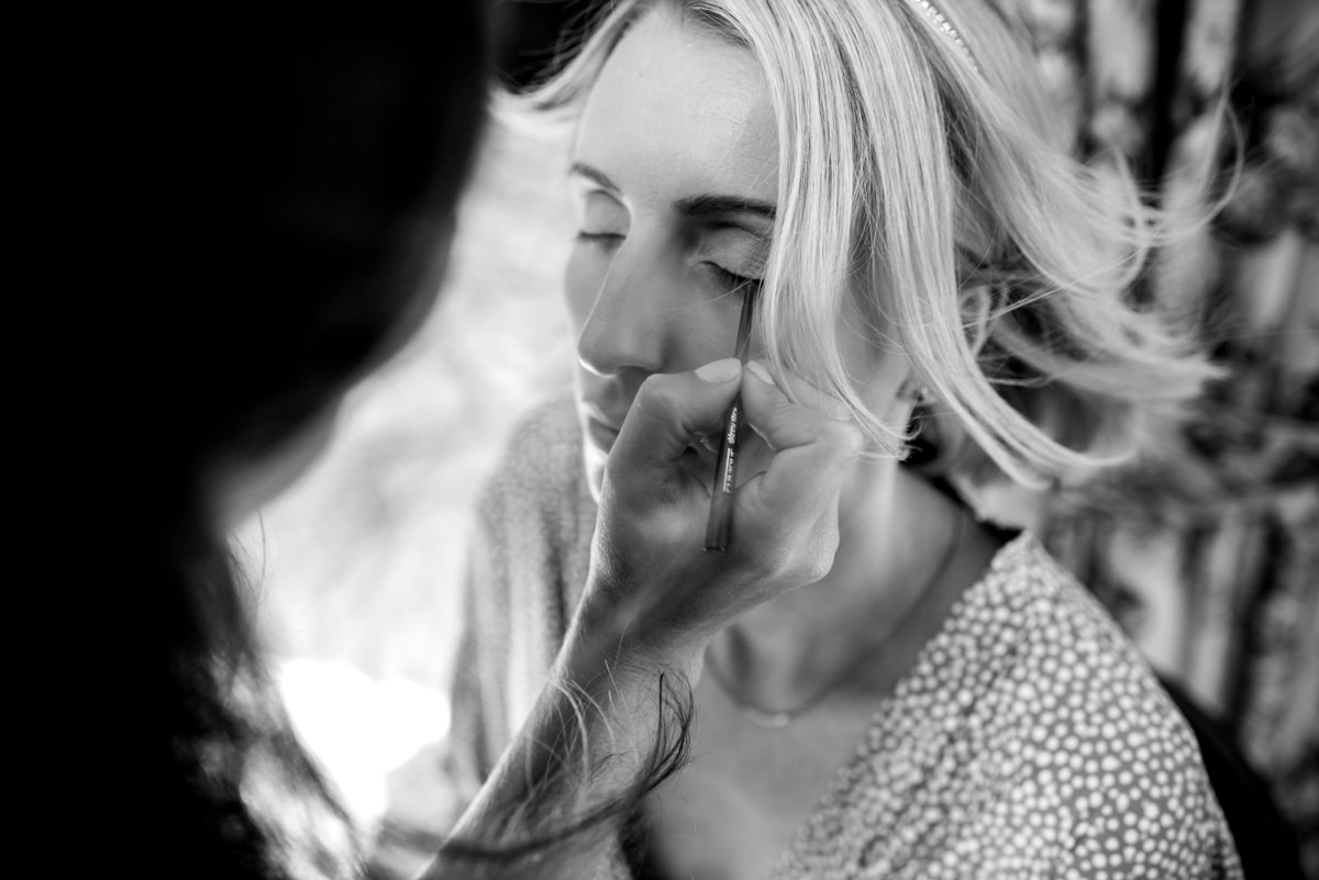 bride having makeup applied