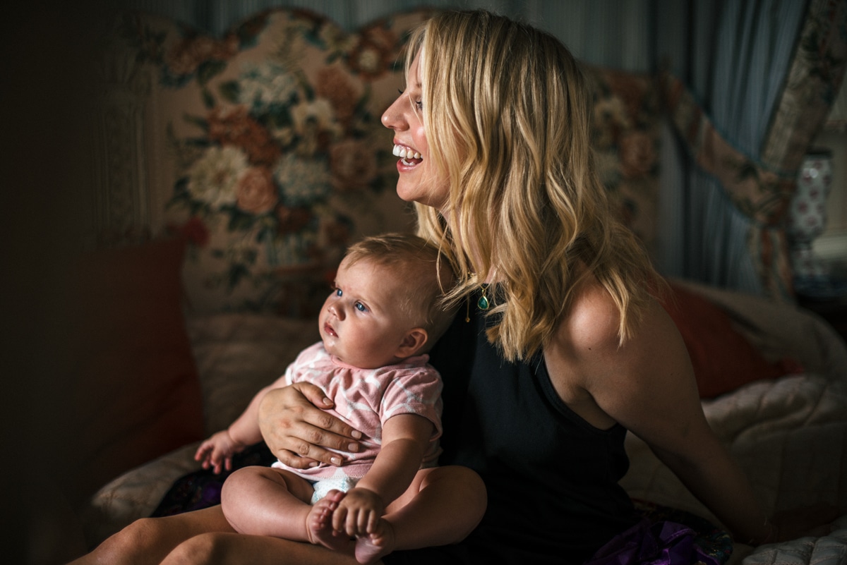 bridesmaid holding baby