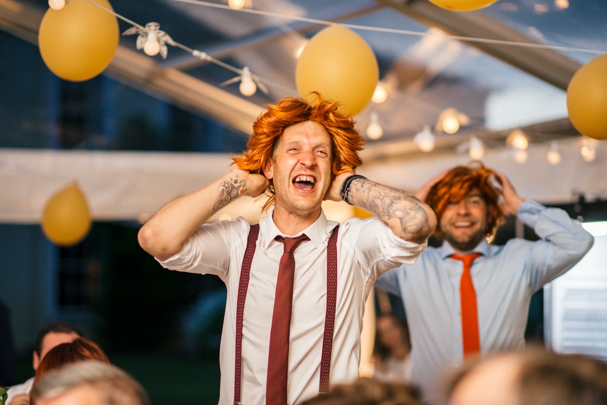 Wedding guests with ginger wigs on