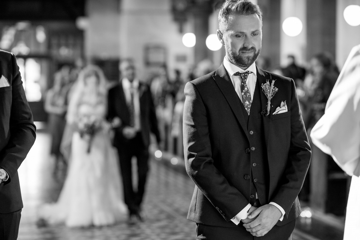 Groom waiting for bride to walk down the aisle