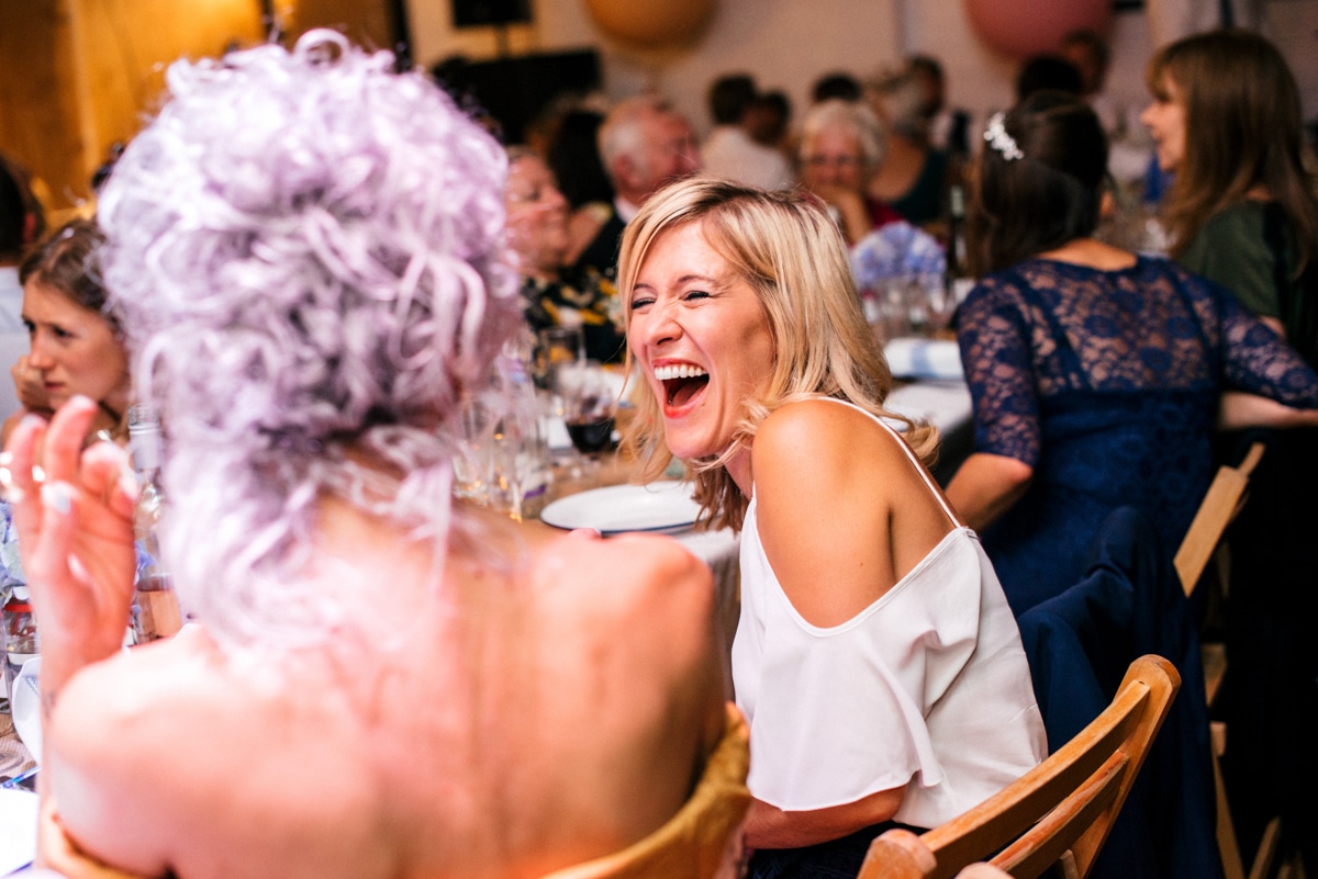 Guests laughing during wedding breakfast