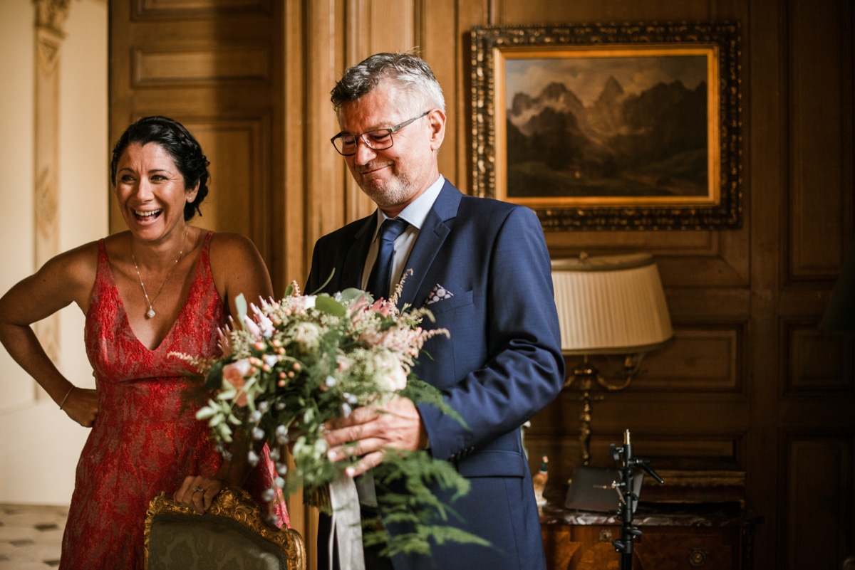 Father of bride seeing his daughter for the first time at wedding