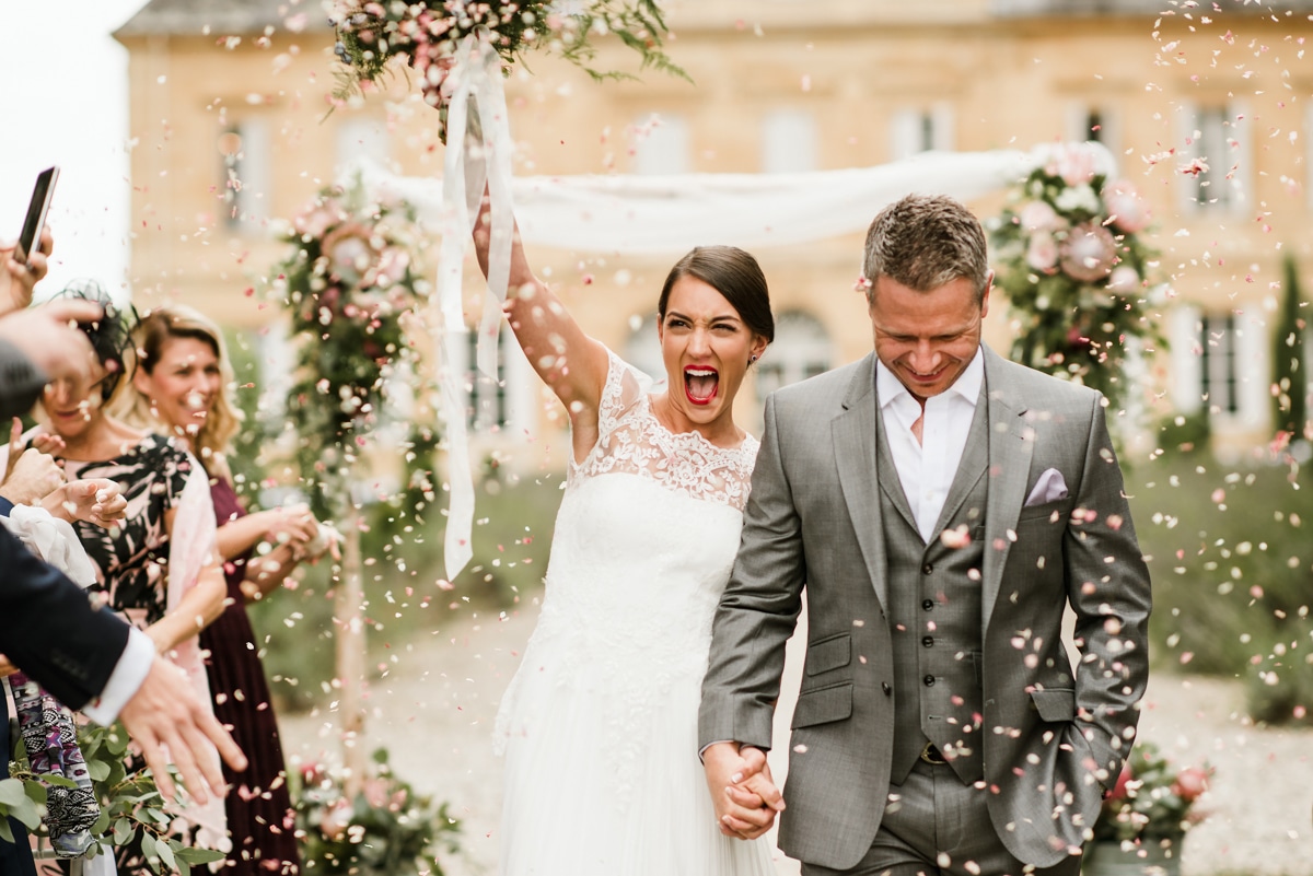 bride and groom walking down the aisle at Chateau du laurantie