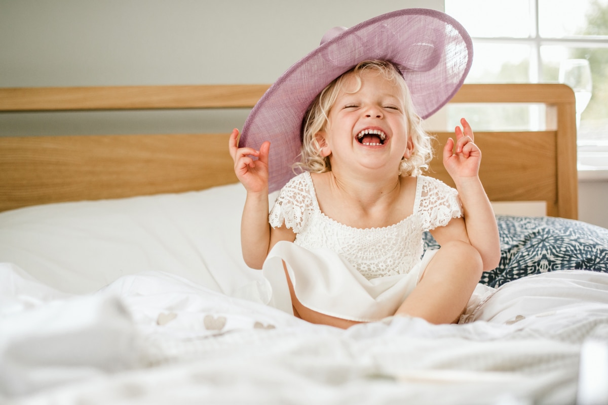 Flower girl wearing large hat