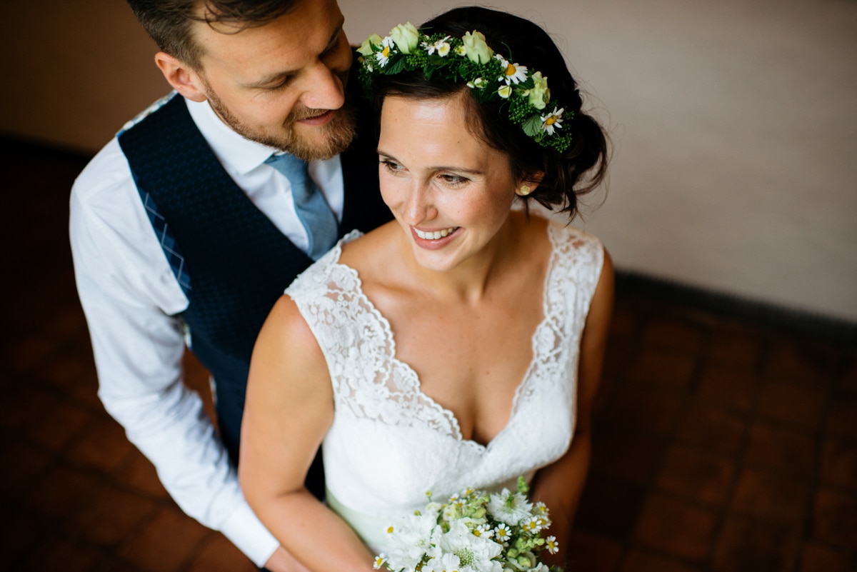 Bride and groom portraits, bride with flower crown in her hair, German wedding