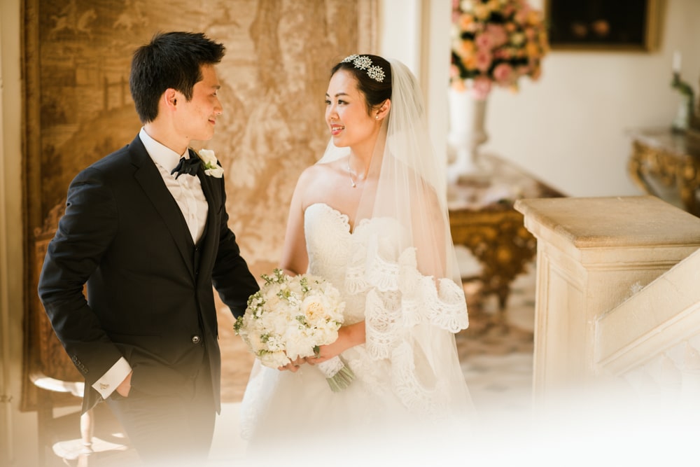 Bride and groom portrait on stairs at Chateau De Laurantie