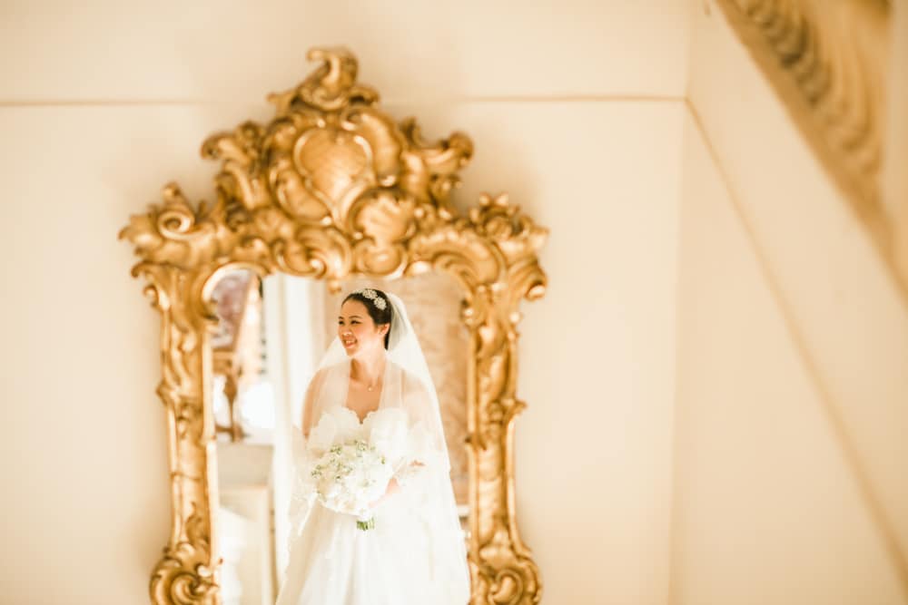 Reflection of bride in mirror