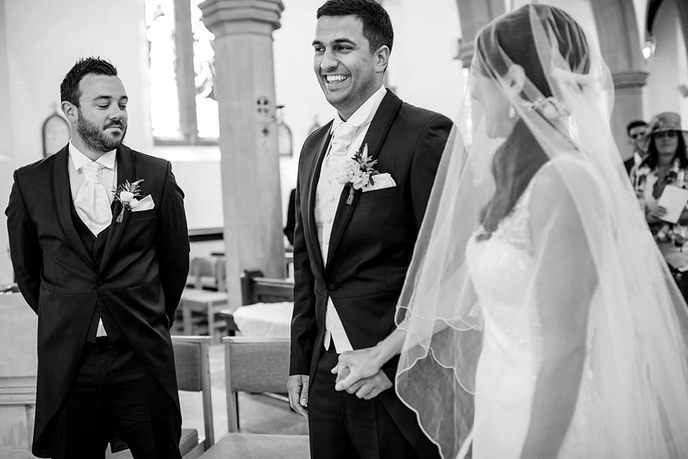 groom laughing in church