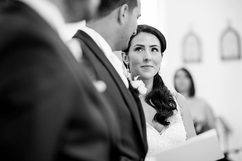 bride looking at groom during ceremony