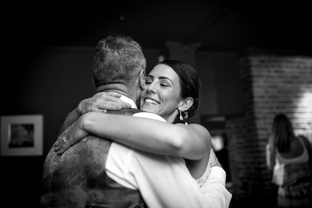 bride hugging dad