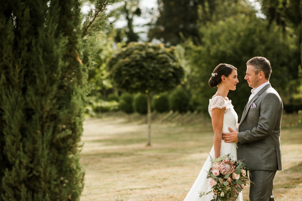 bride and groom portraits in the gardens of Chateau La Durantie France
