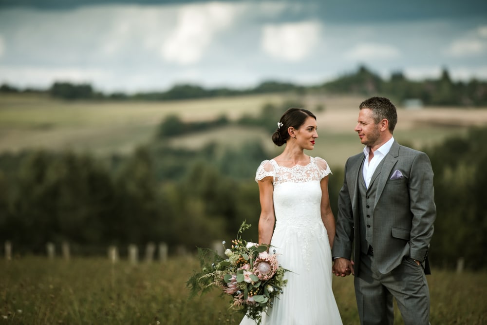 bride and groom portrait in field in France