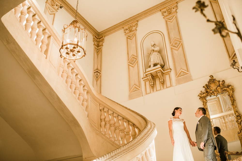 bride and groom on the stairs at Chateau La Durantie